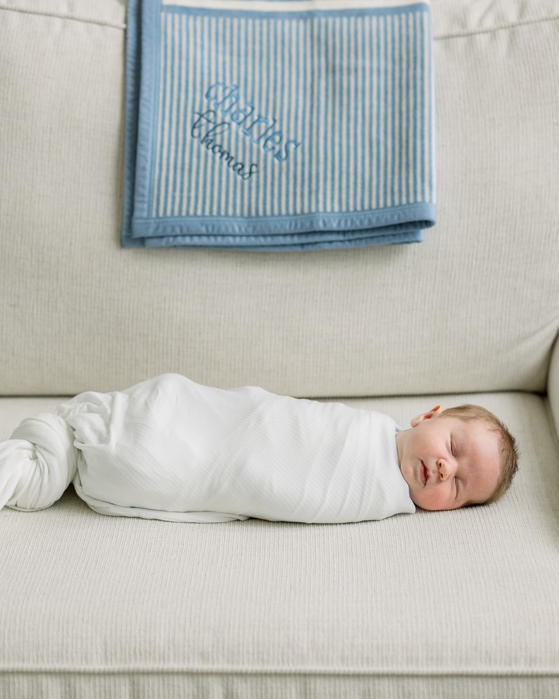 Newborn resting peacefully in a bassinet
